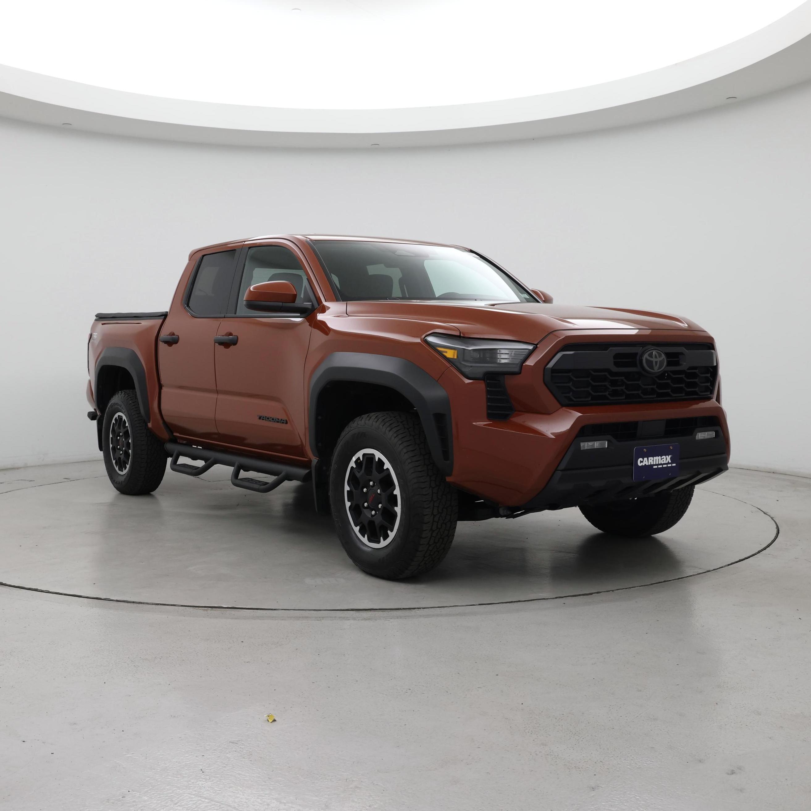 Orange 2025 Toyota Tacoma Pickup Truck Four-Wheel Drive Manual